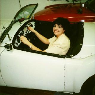 Paige sitting in Charles Wiggins' MGA 1500